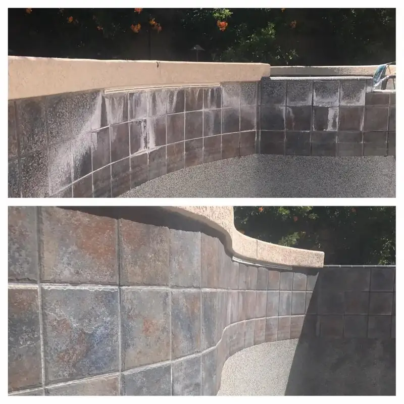 A grey slate tile wall and a curved wall beside a pool, scaled white and then restored to dark grey